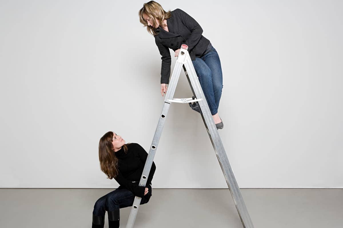 Two women on a step ladder